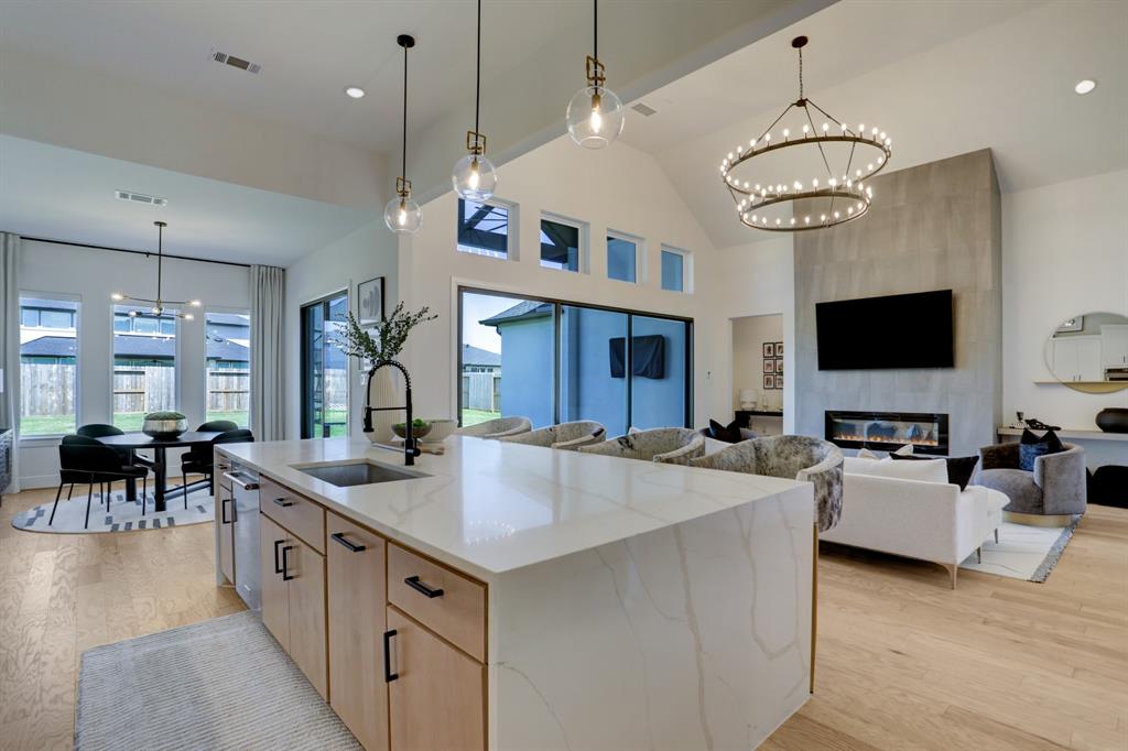 The kitchen over-looking the spacious living area is perfect for entertaining!!