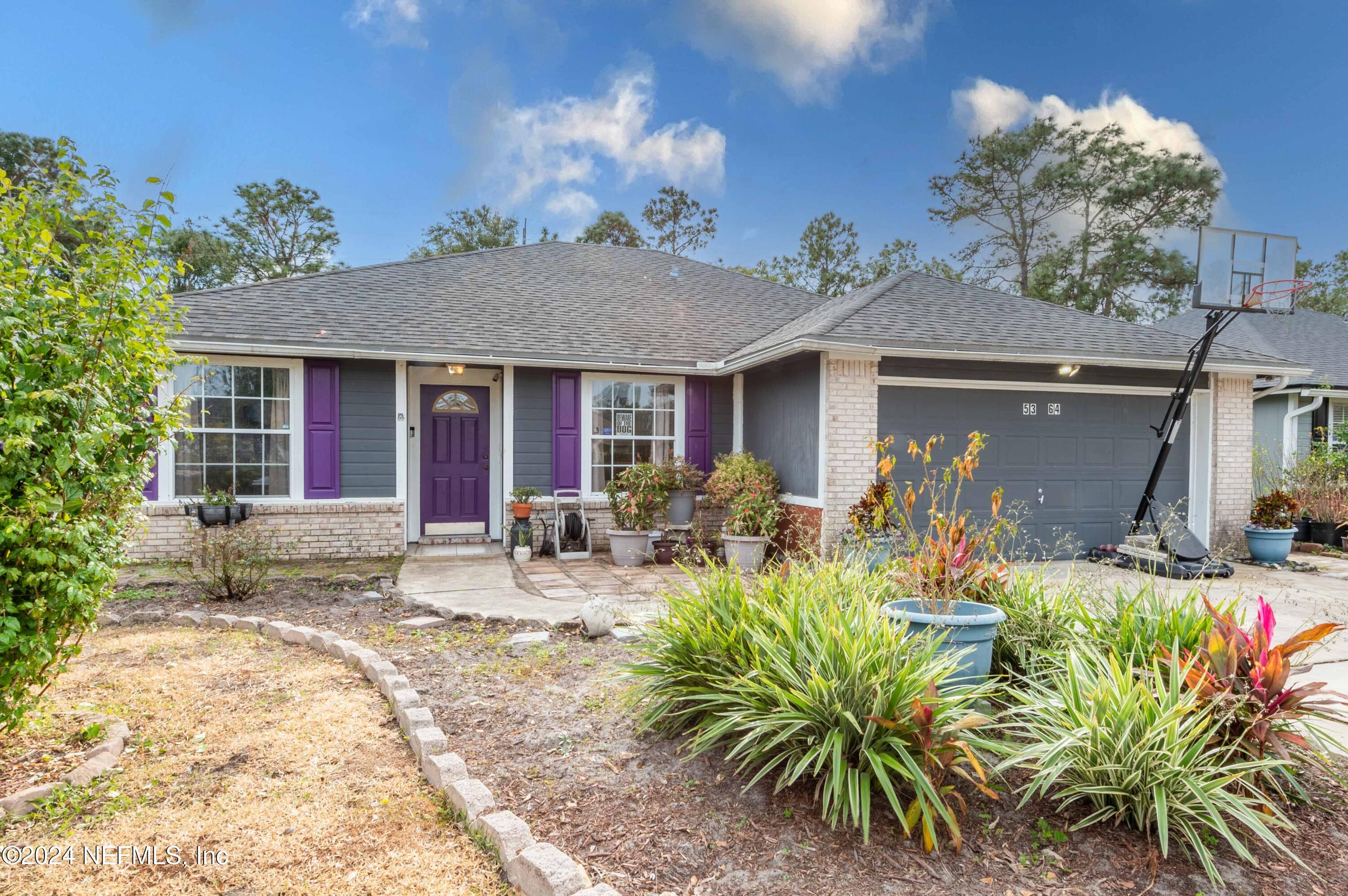 a view of a house with patio front of house