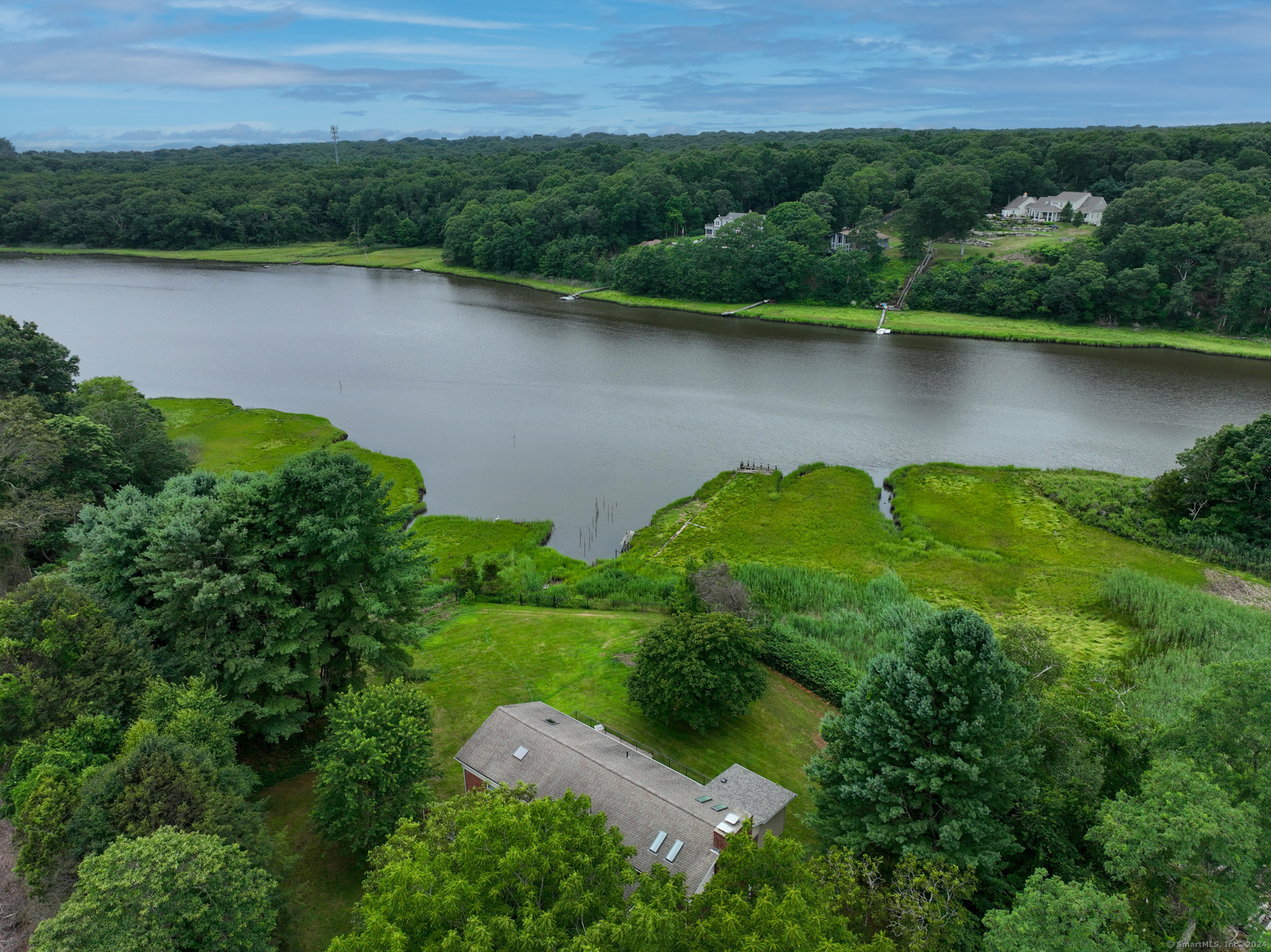 an aerial view of a house with a lake view