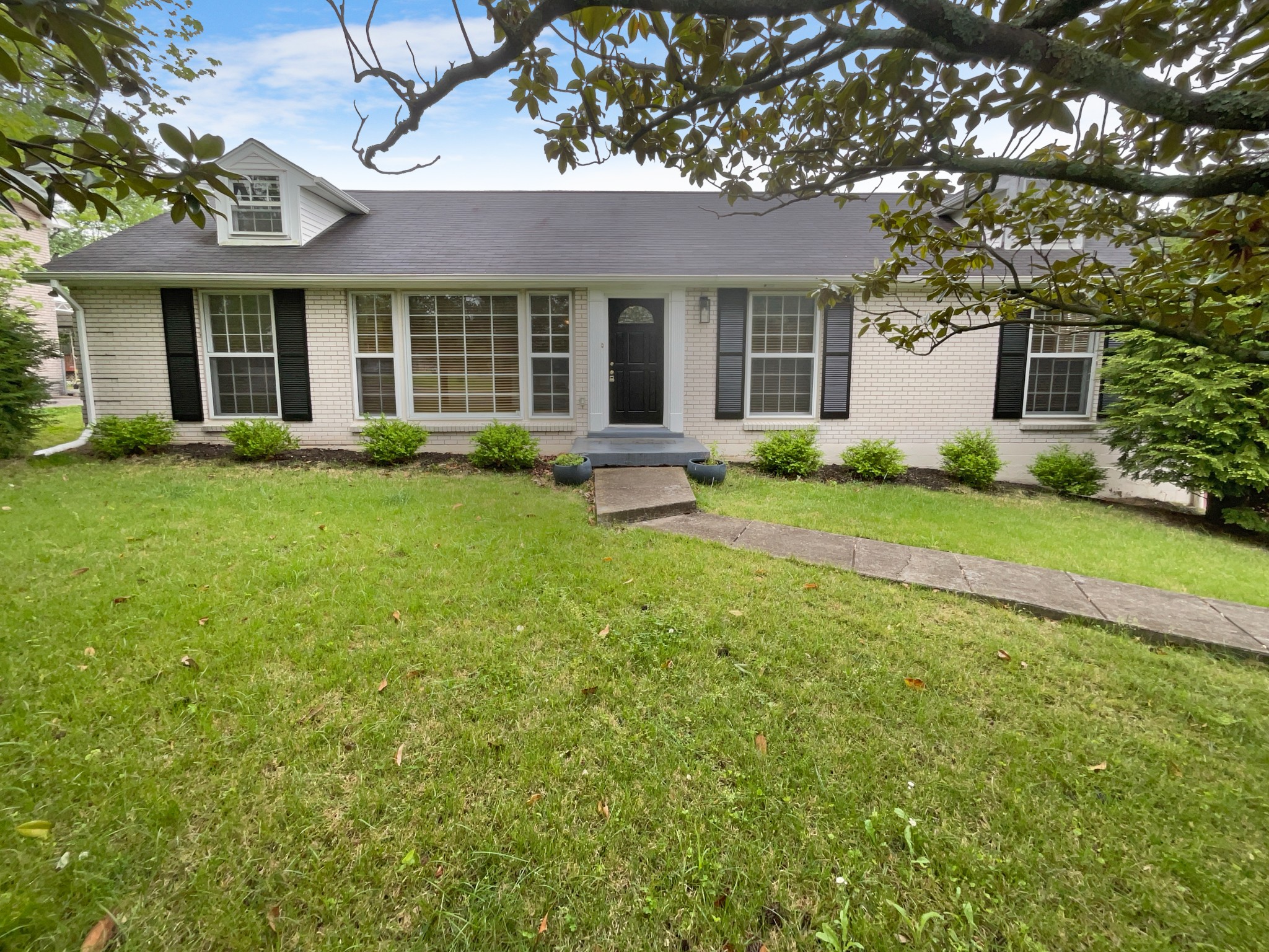 front view of a house and a yard