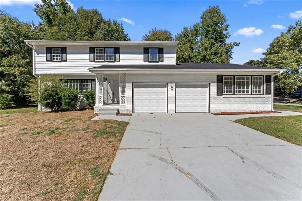 front view of a house with a yard