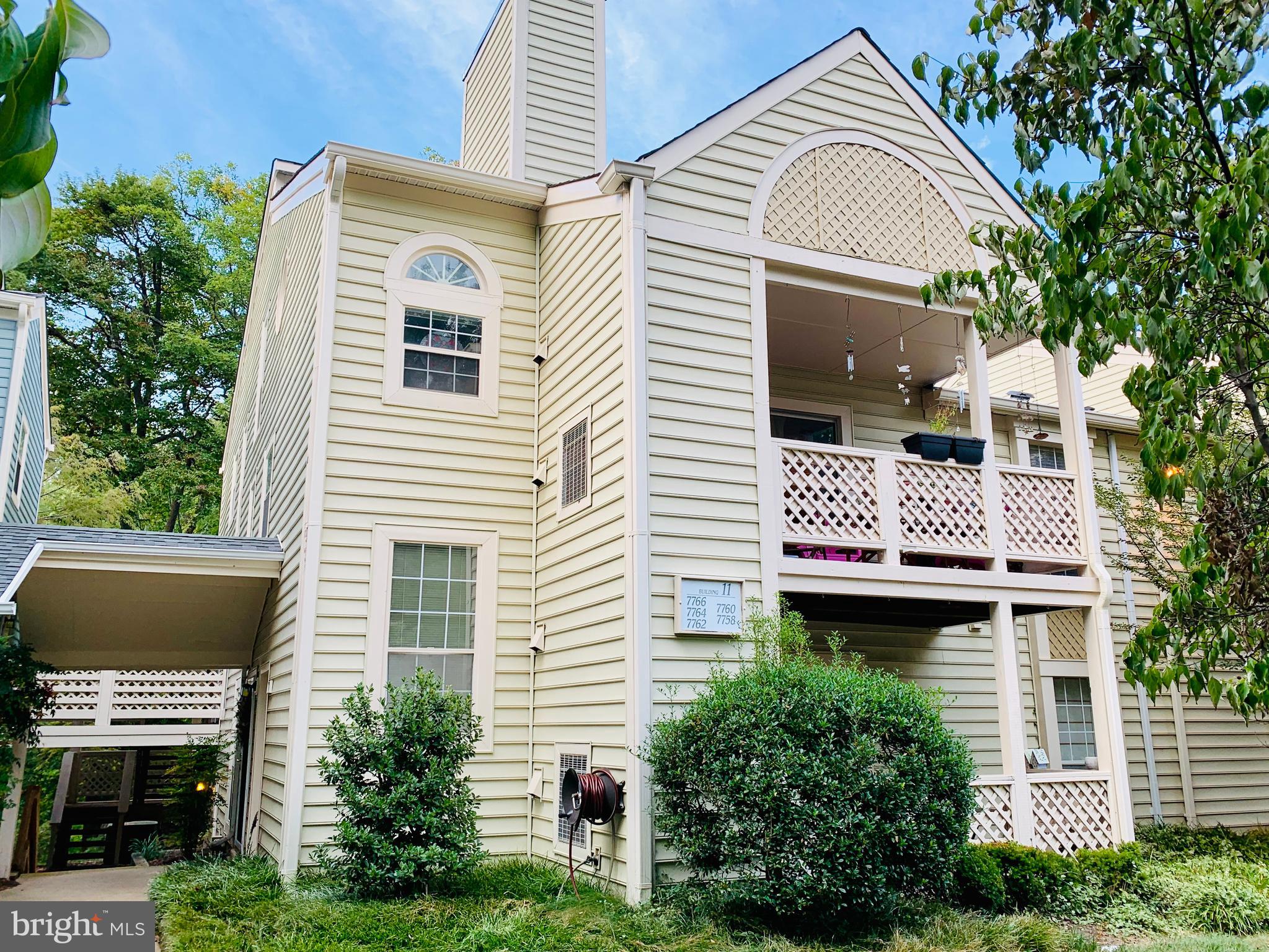 a view of a house with a chairs in patio