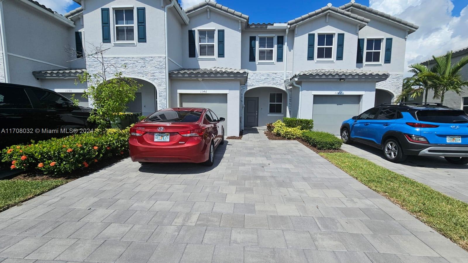 a house view with a garden space