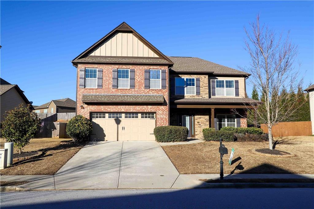 a front view of a house with yard