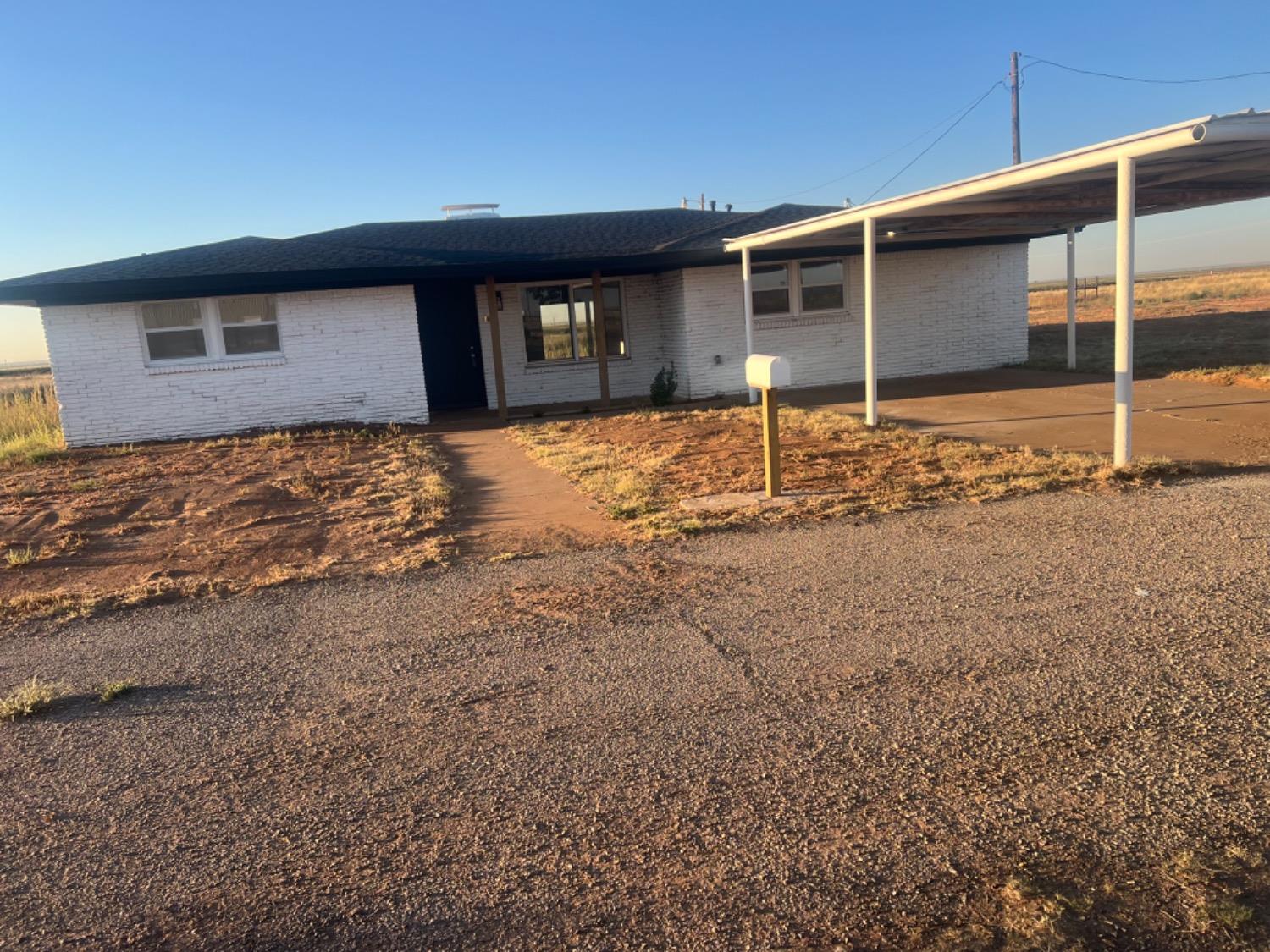 a backyard of house with garage