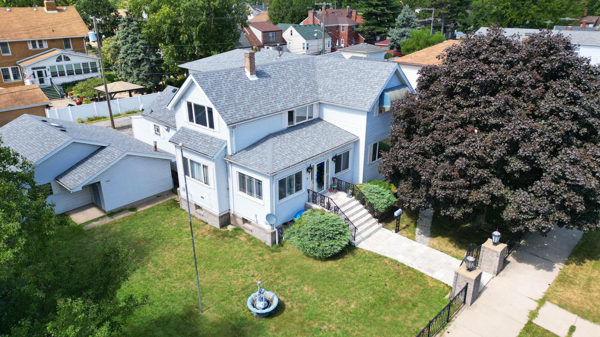 an aerial view of a house with yard