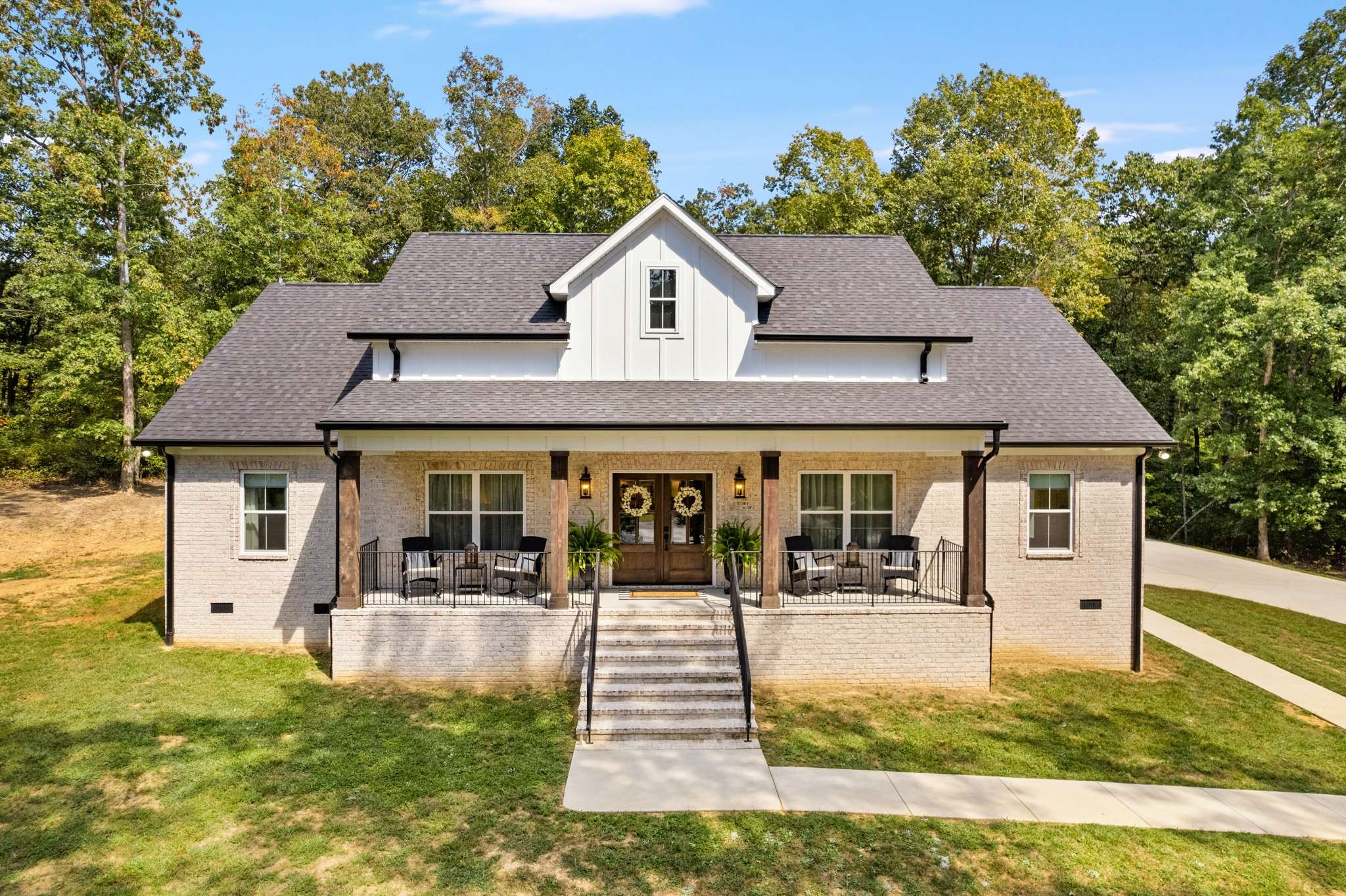 a front view of a house with a yard