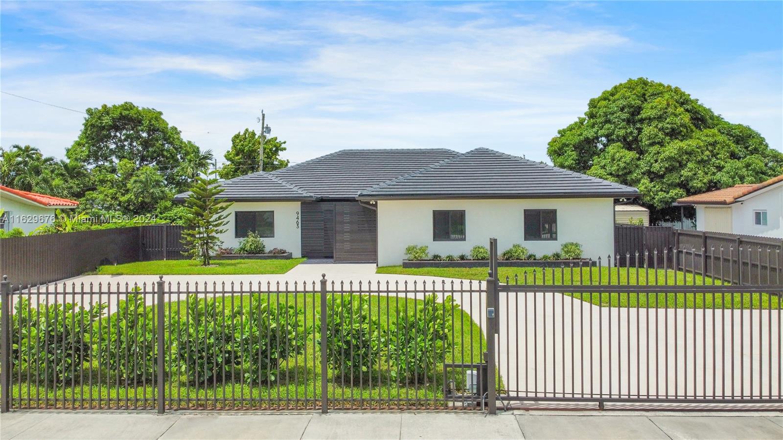 a front view of a house with a garden