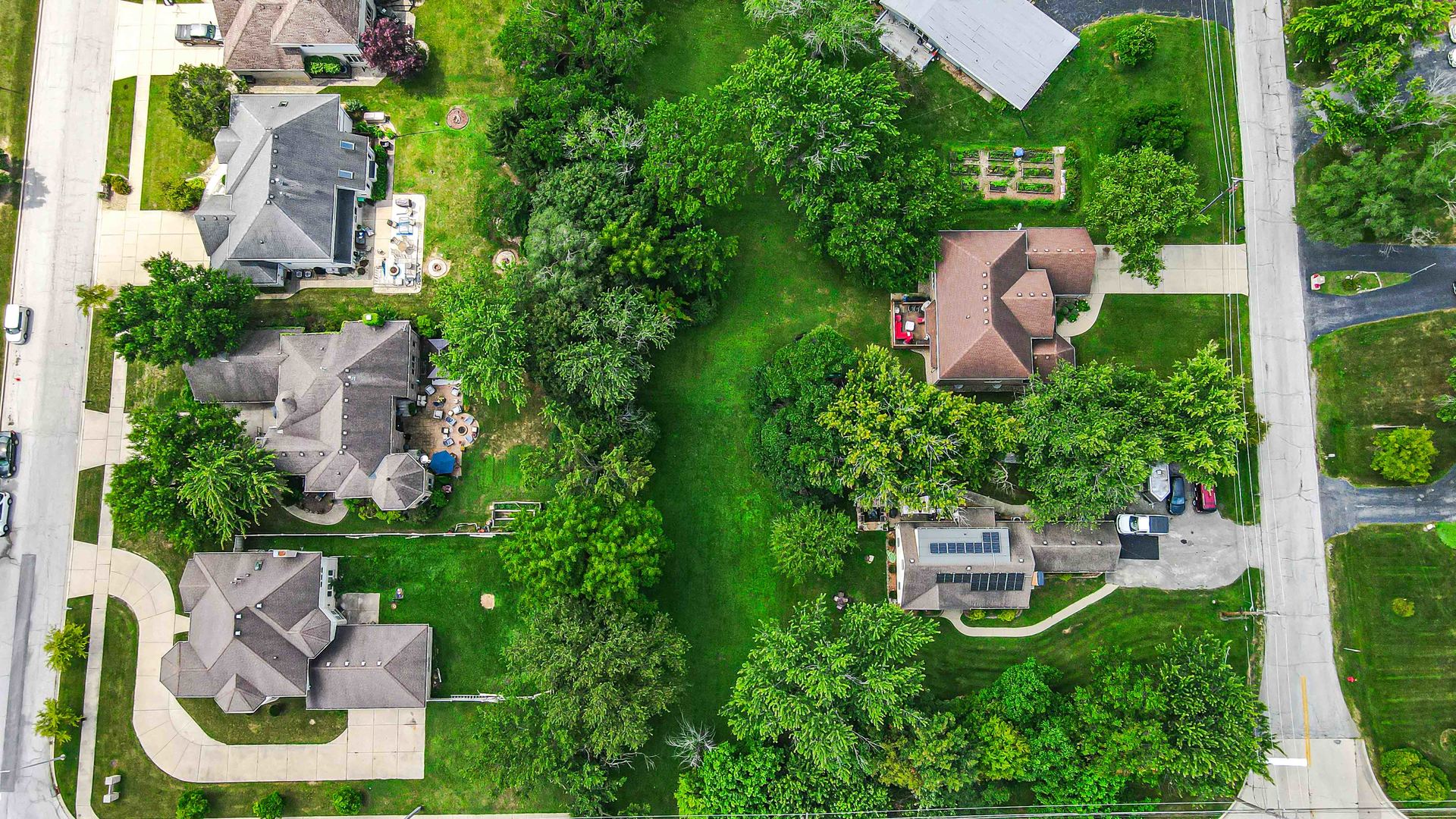 an aerial view of a house with outdoor space