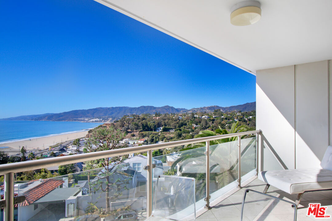 a view of a balcony with an ocean view