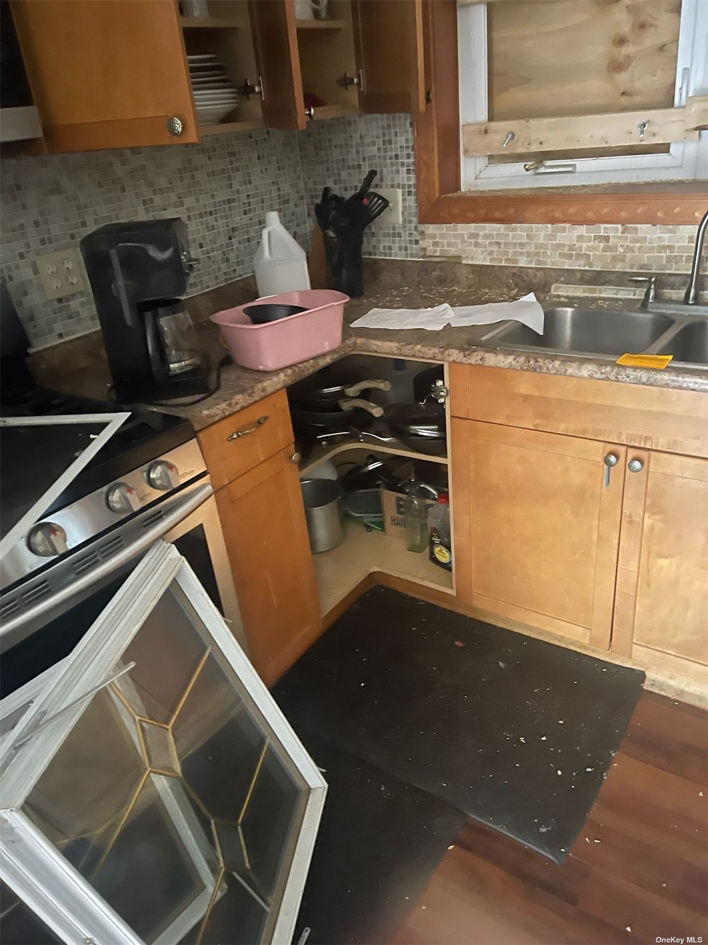 a stove top oven sitting inside of a kitchen