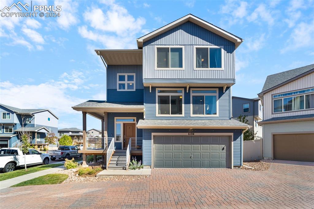 View of front of property with a garage