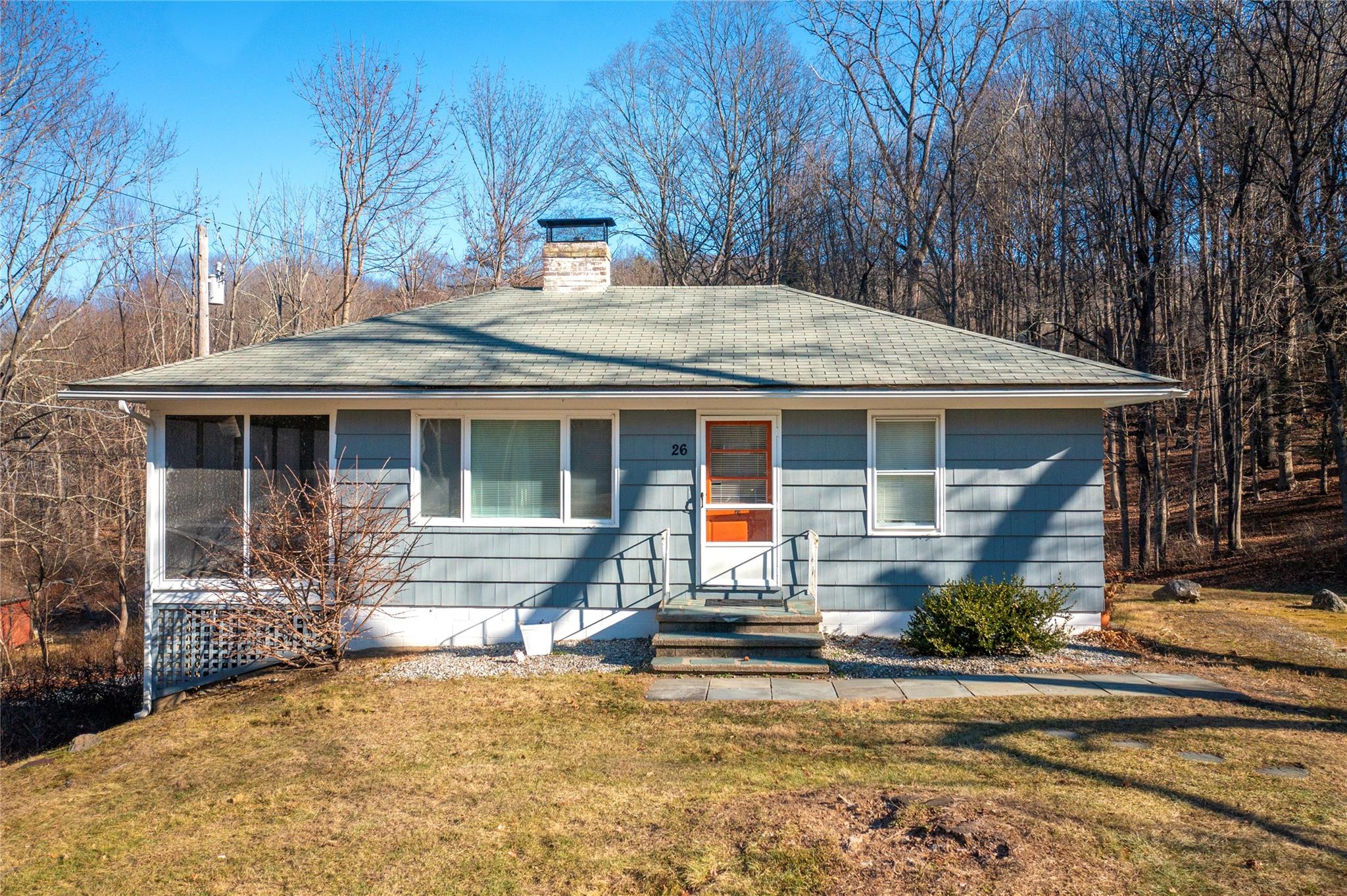 Single story home featuring a front yard