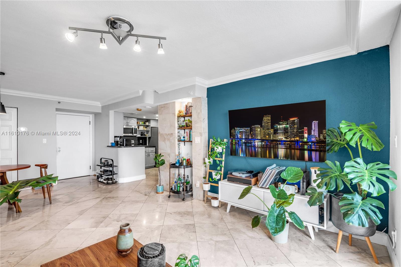 a living room with furniture dining room and a flat screen tv