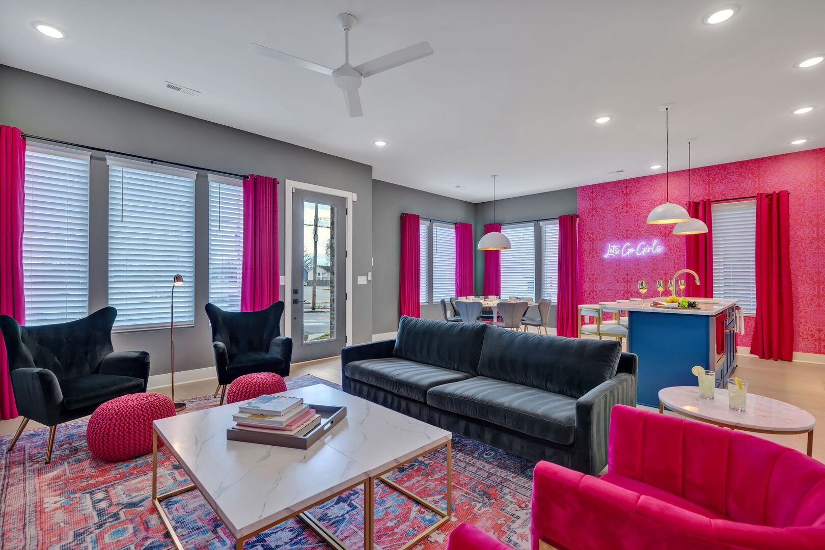 a living room with furniture and a red lamp