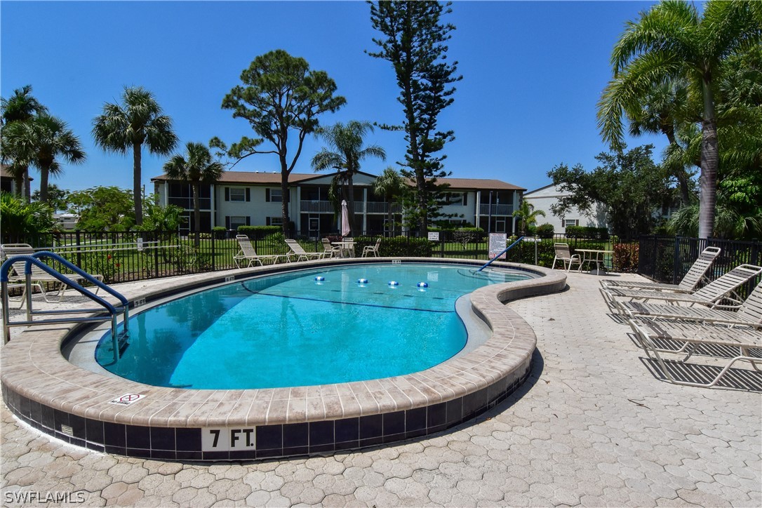 a view of a swimming pool with a yard