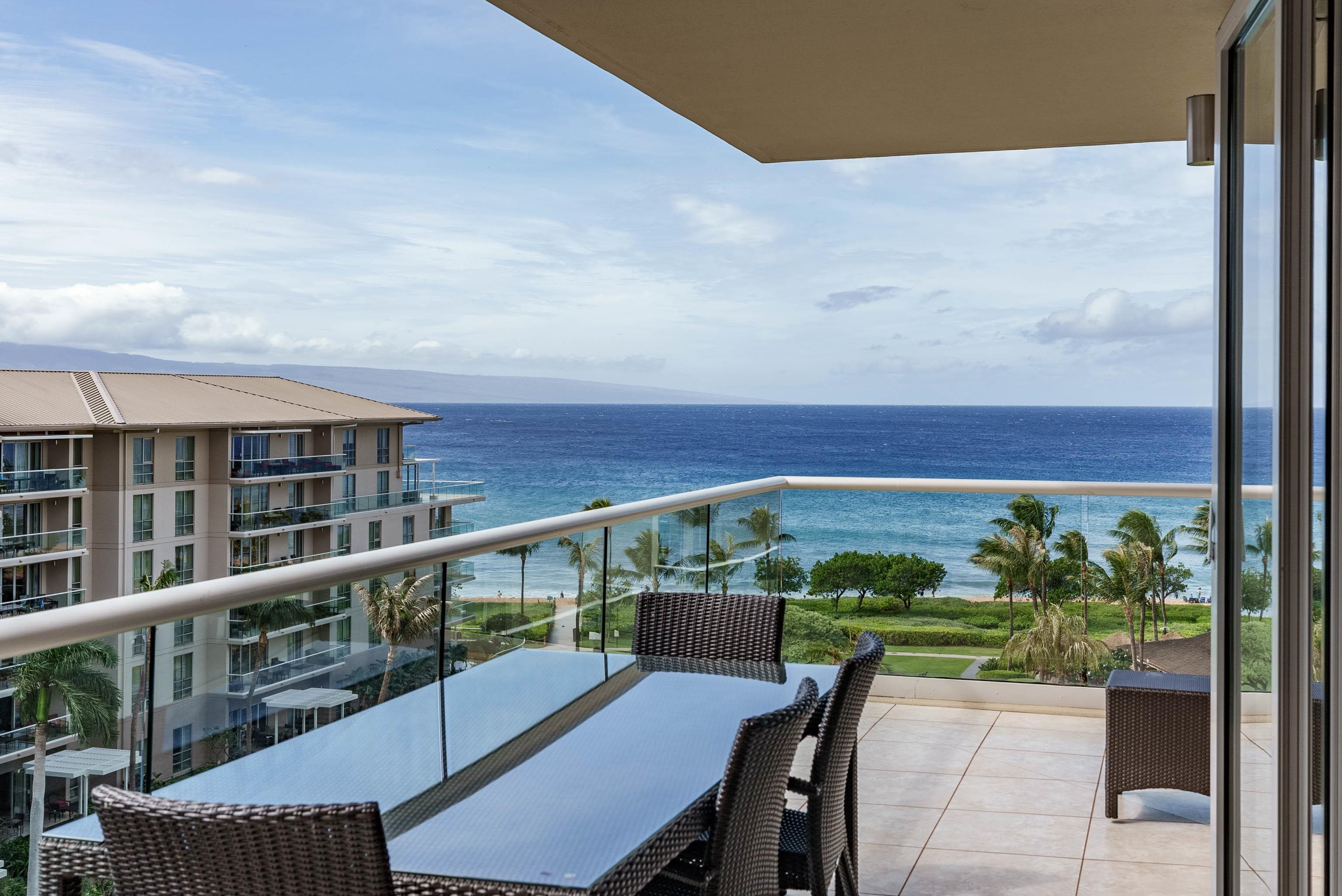 a view of a balcony with furniture