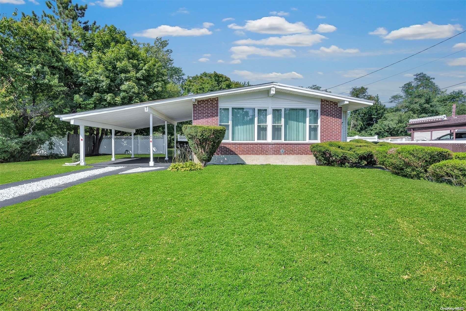 a front view of a house with a yard and porch