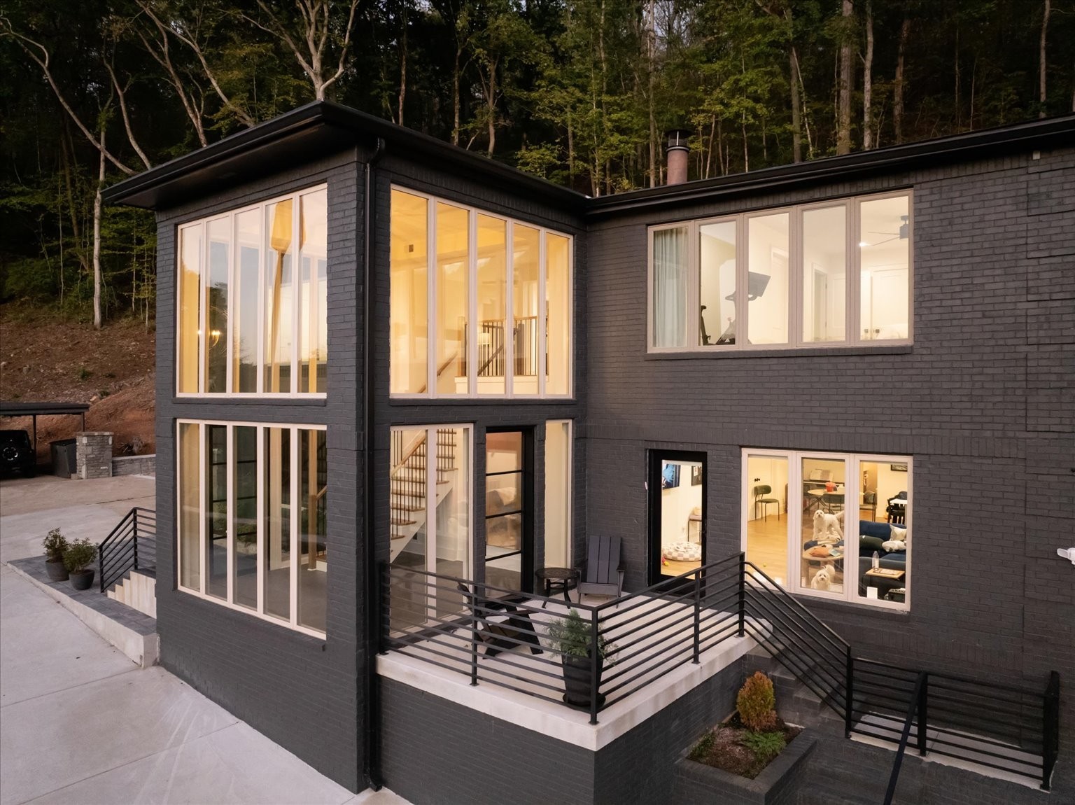 This angle shows the main level entrance that boasts a beautiful open concept family room/kitchen with an oversized bedroom, gorgeous bathroom and another room to be used as second bedroom/office etc.