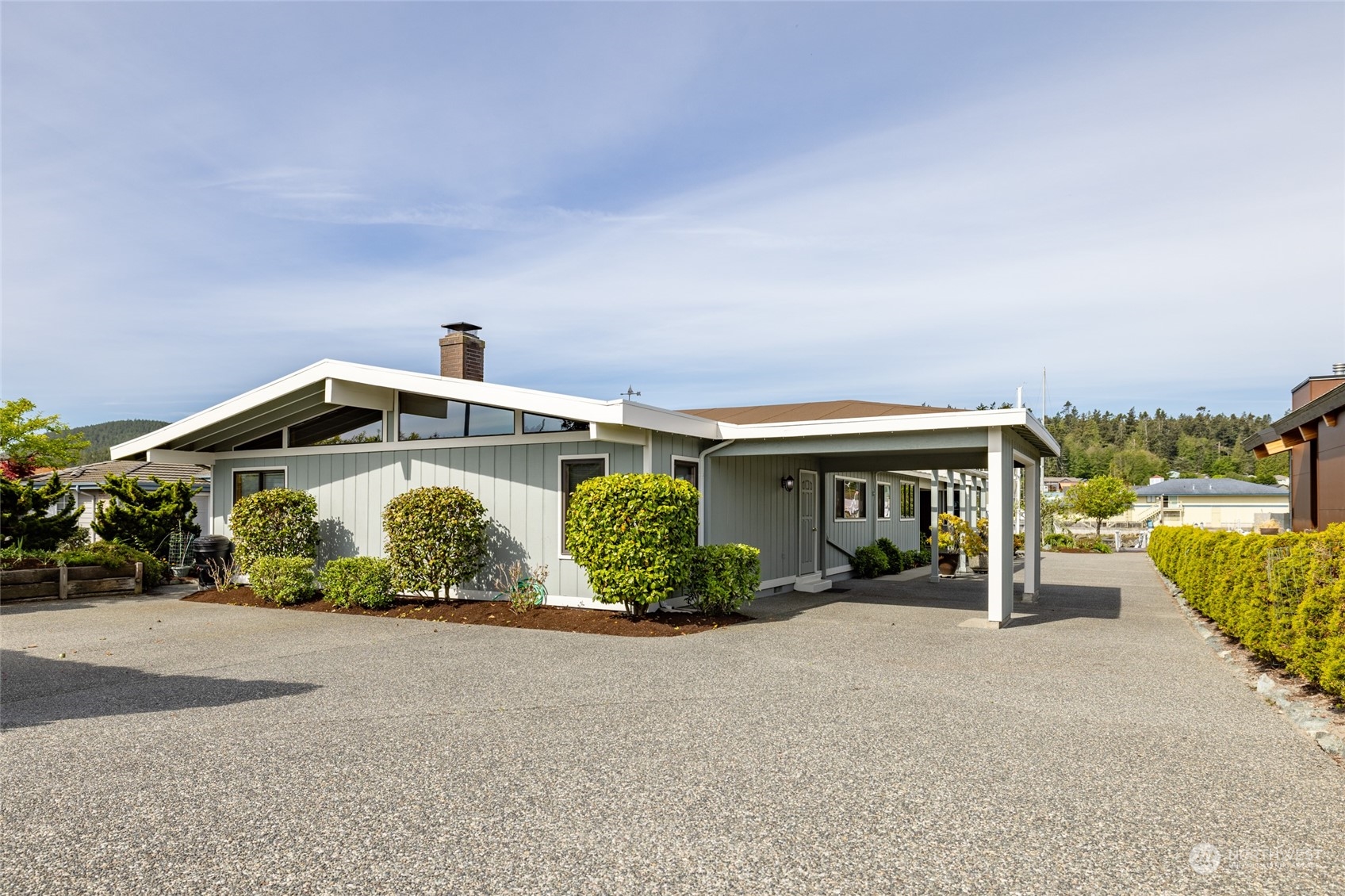 a front view of a house with garden