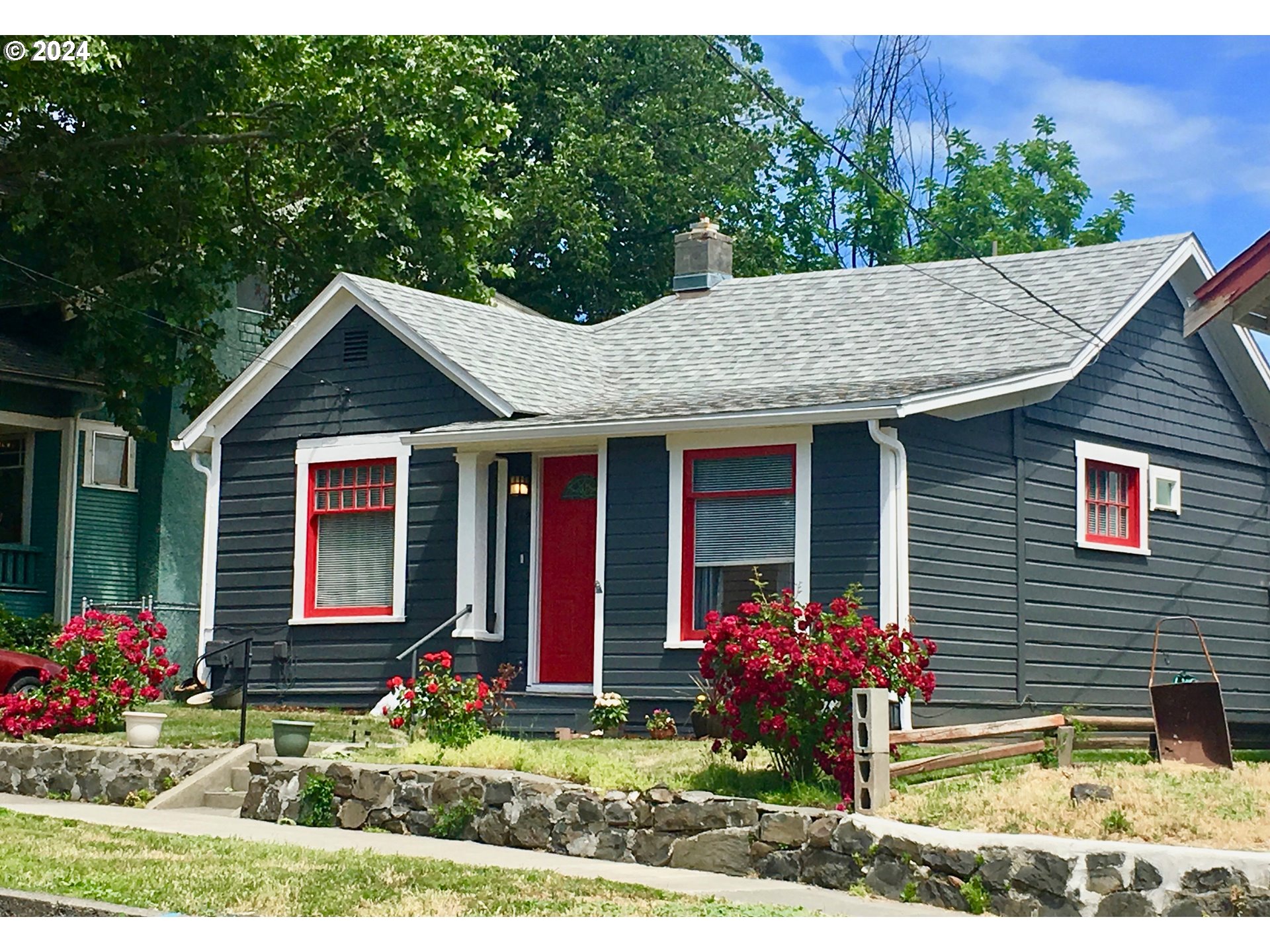 a front view of a house with garden