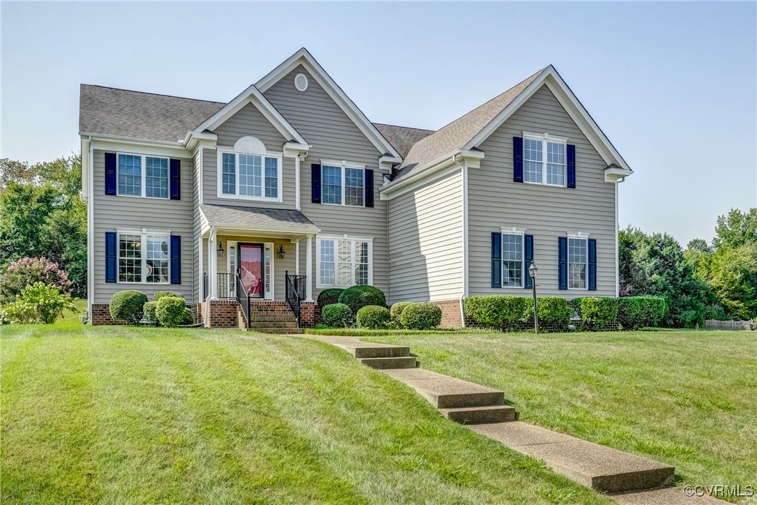 a front view of a house with a yard