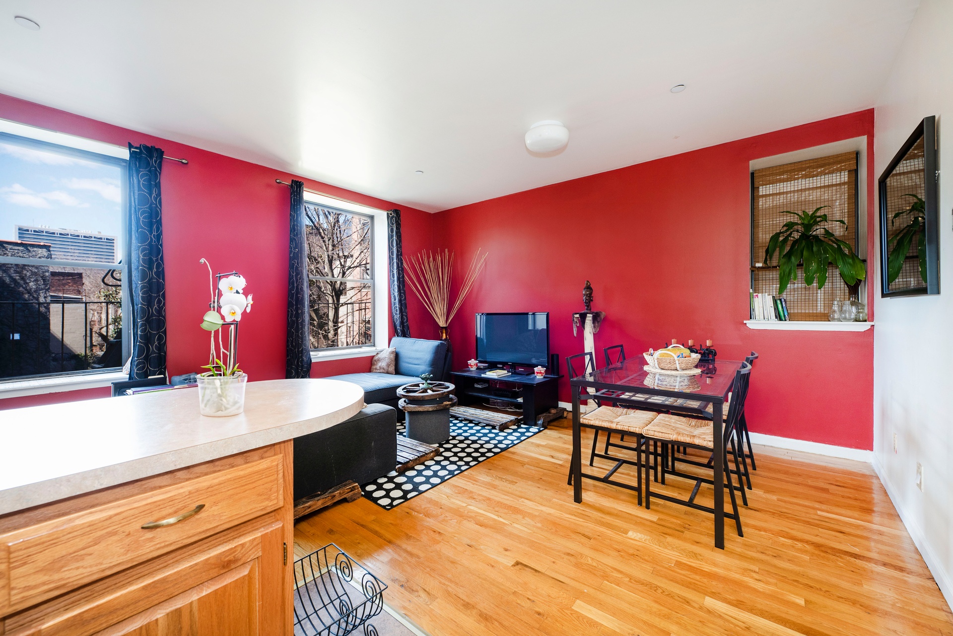 a living room with furniture a rug and a lamp