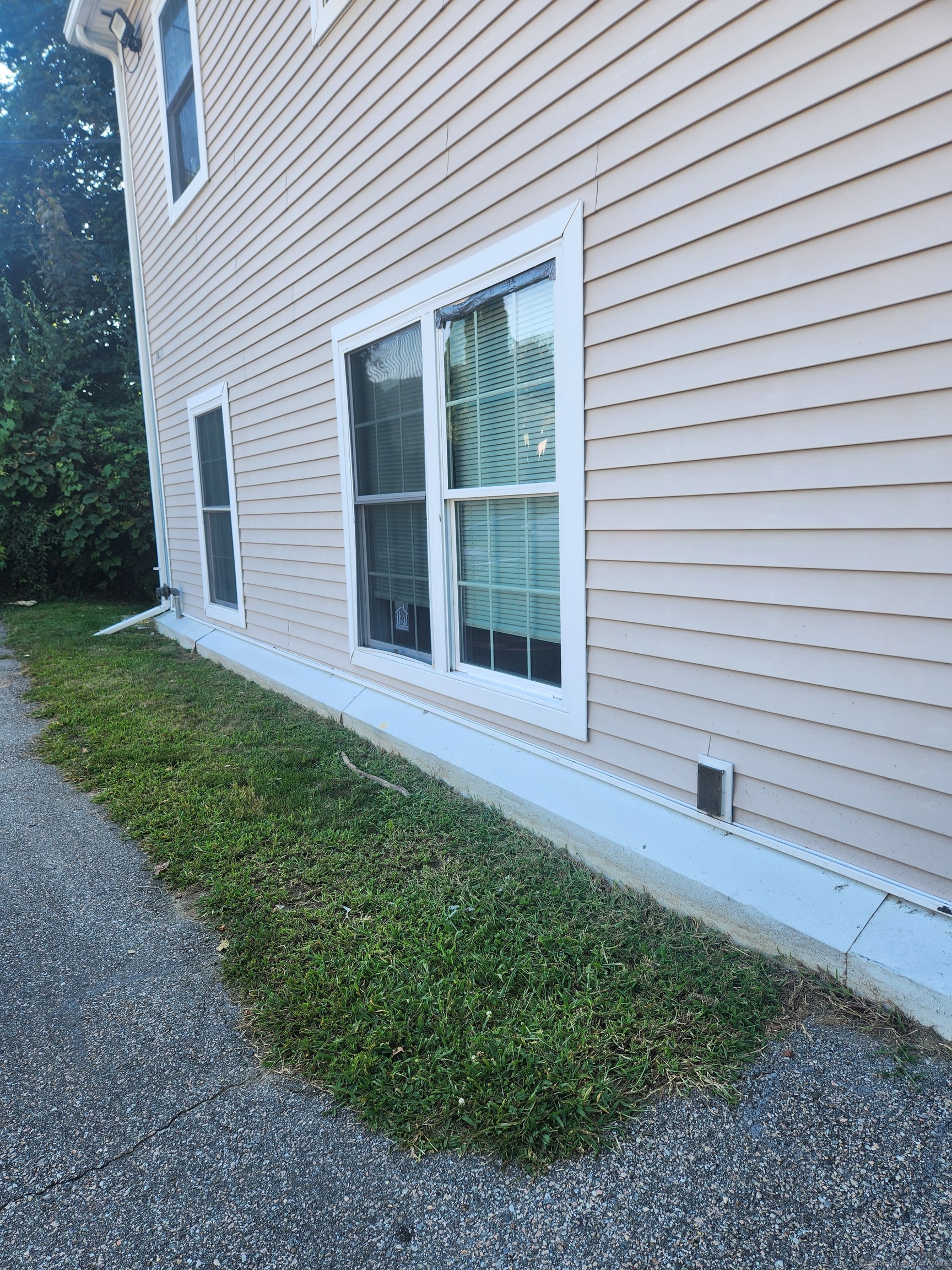 a view of front door of house and yard