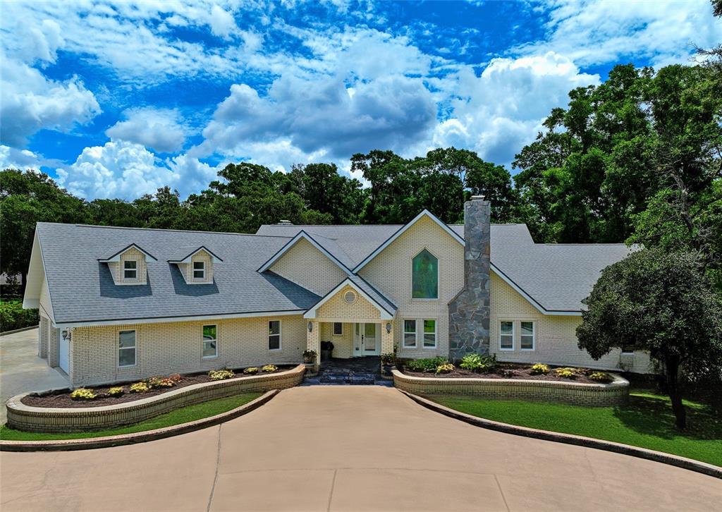 a front view of house with yard and green space