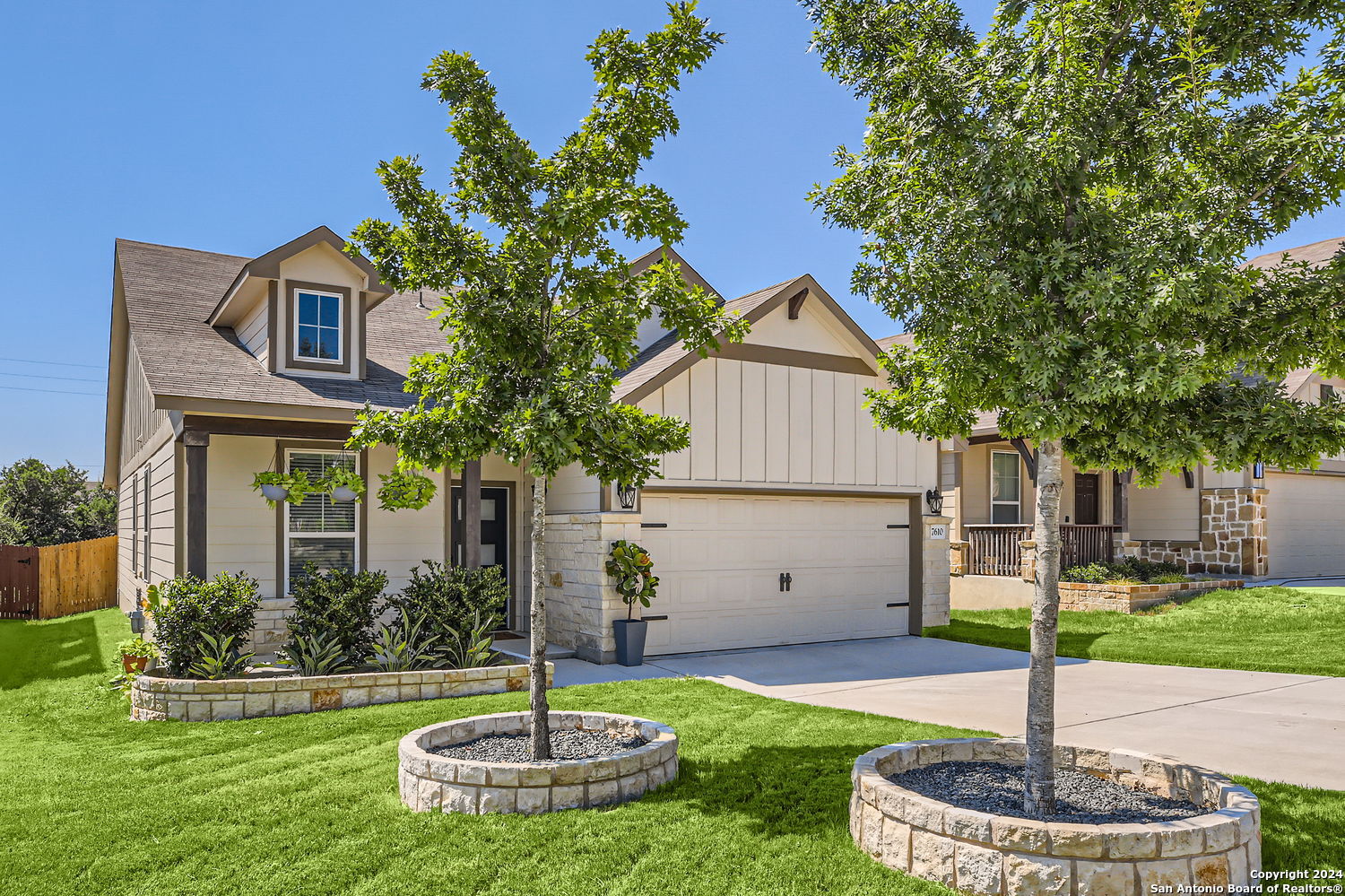 a front view of house with yard and green space