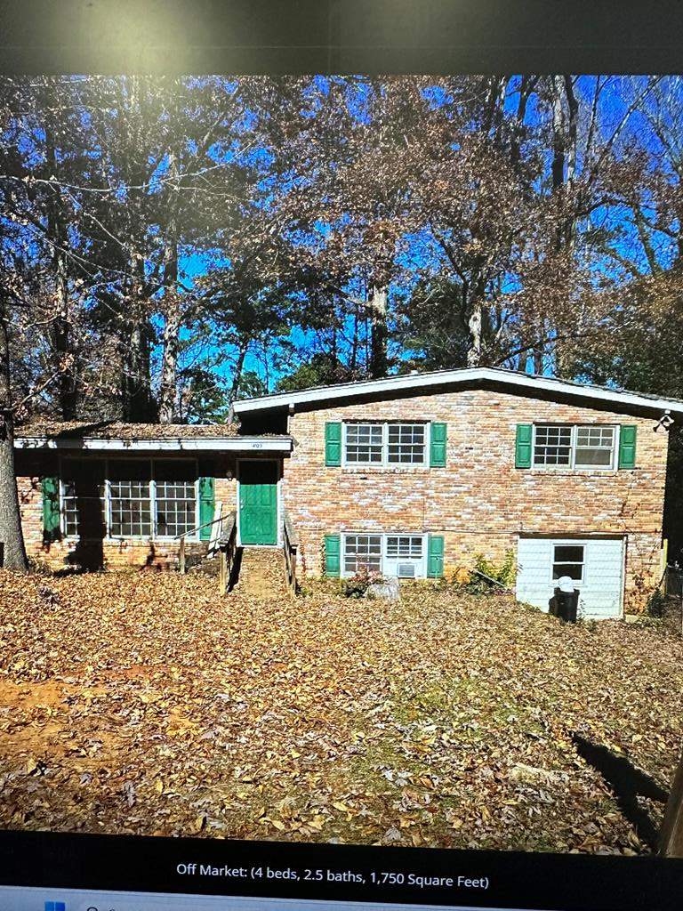 front view of house with a small yard