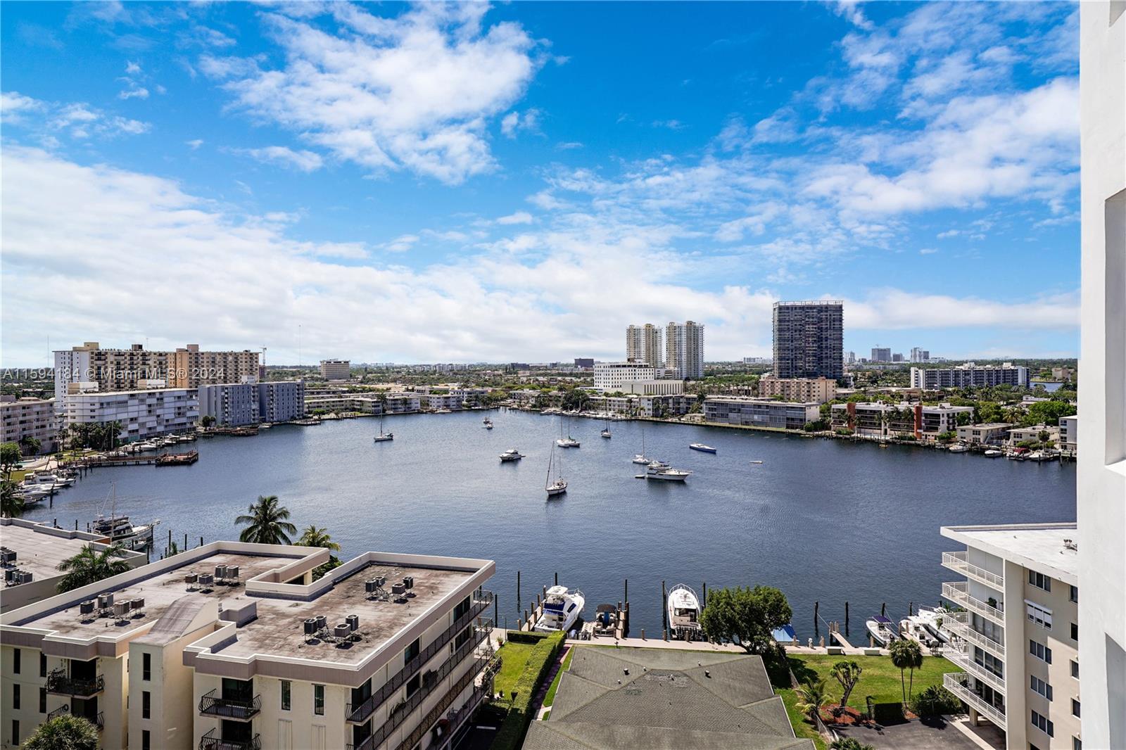 a view of a lake with tall buildings