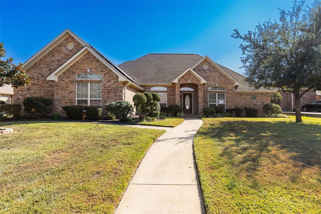 a front view of a house with yard