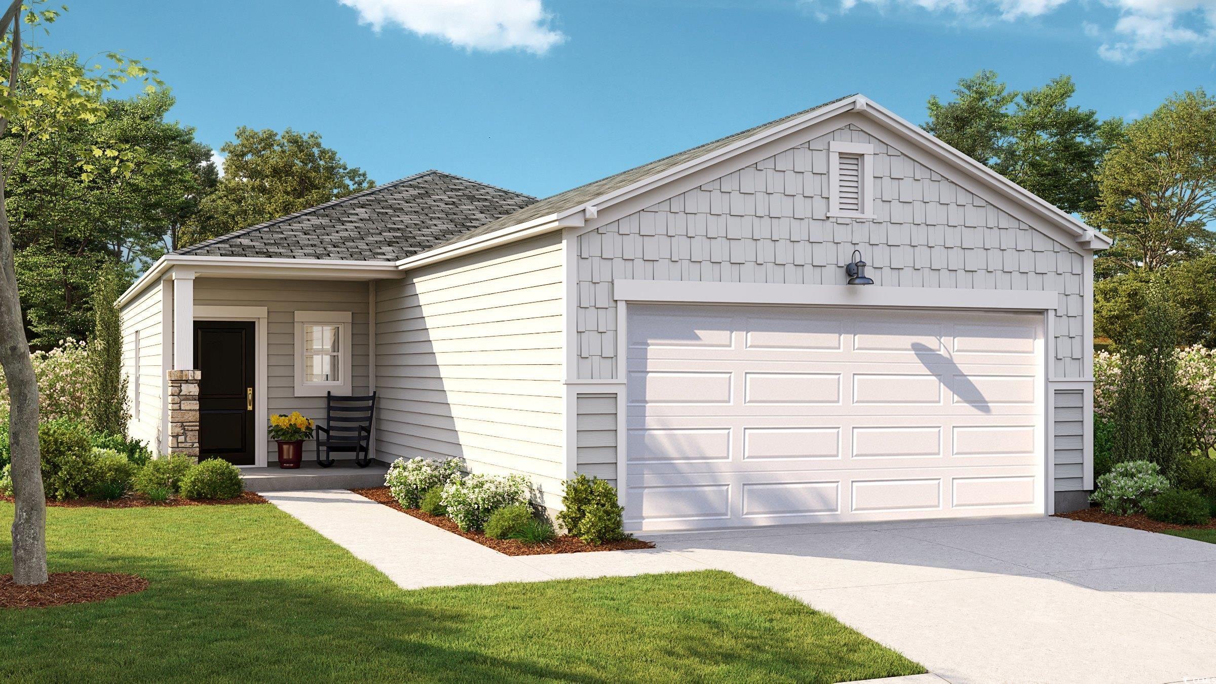 Ranch-style home with a front lawn and a garage