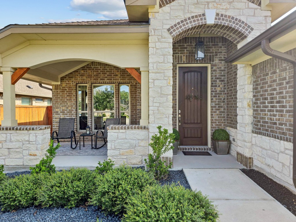 a front view of a house with outdoor seating