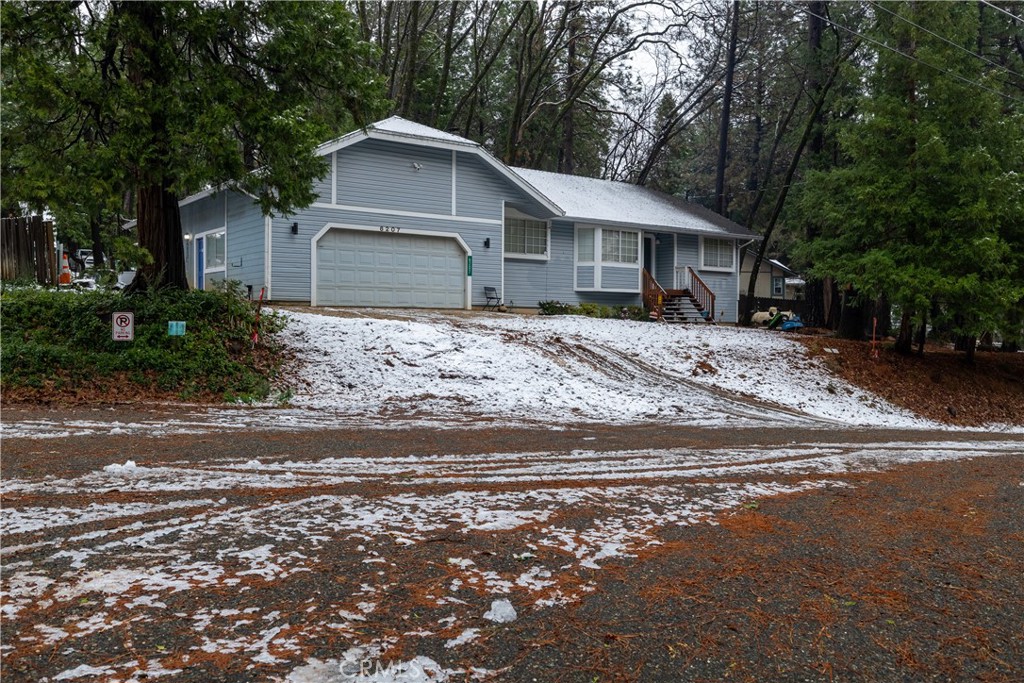 a view of a house with a yard