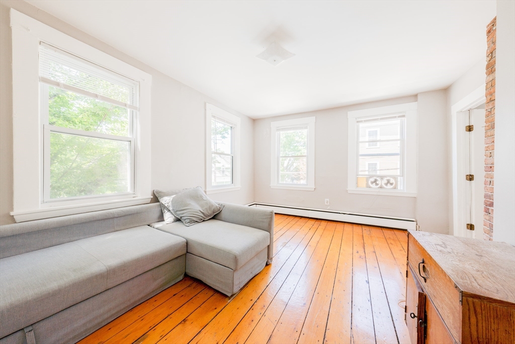 a bedroom with a bed and a window with outer view