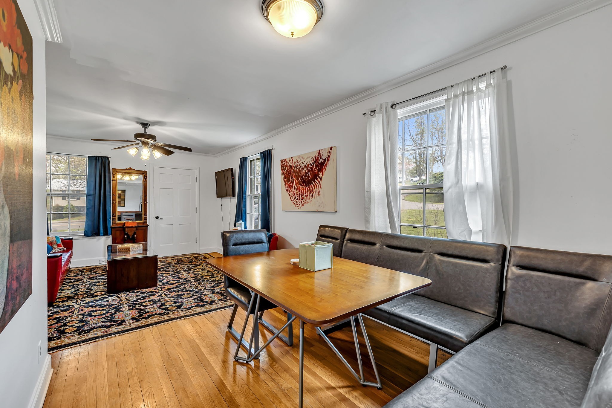 a living room with furniture rug and window