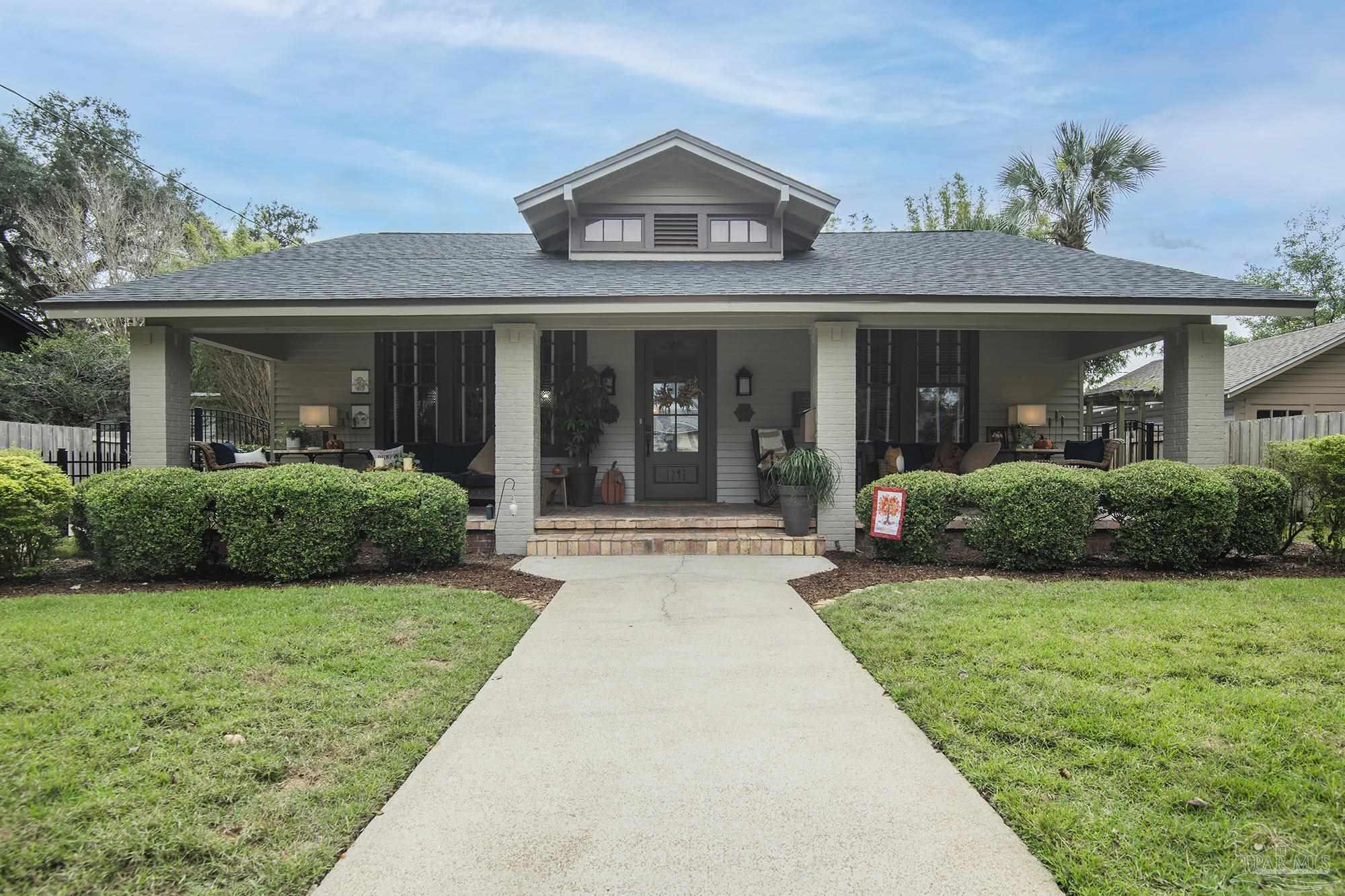 front view of a house with a yard