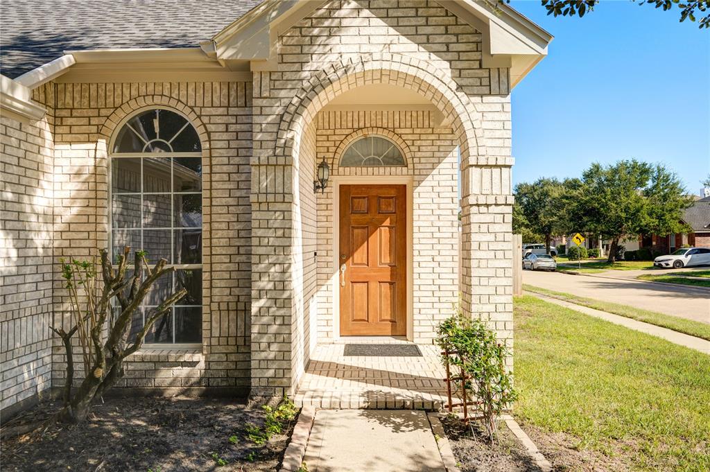 a view of a brick house with a door