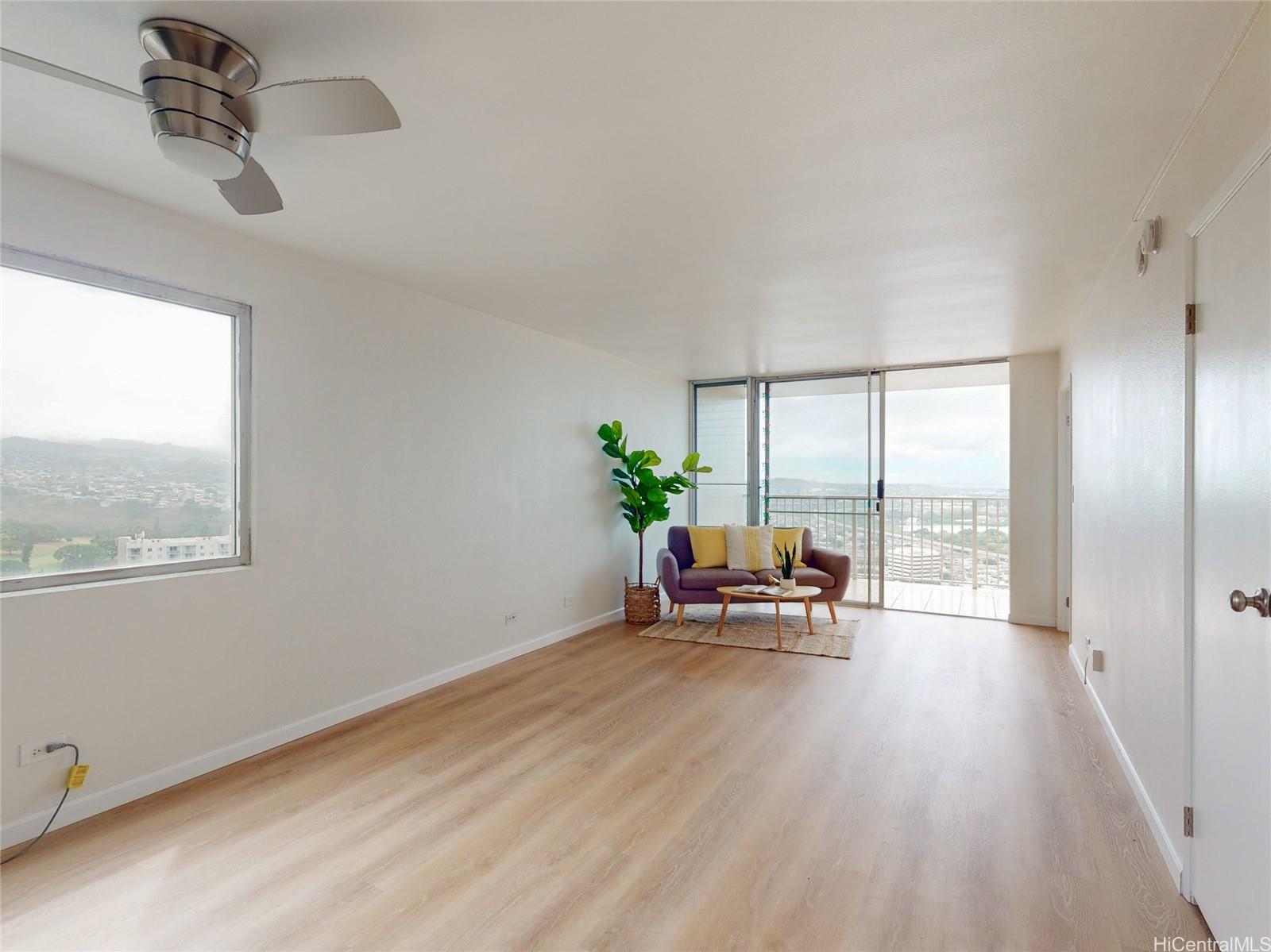 a view of a livingroom with furniture and a window