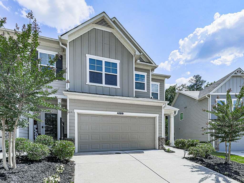 a front view of a house with a garage