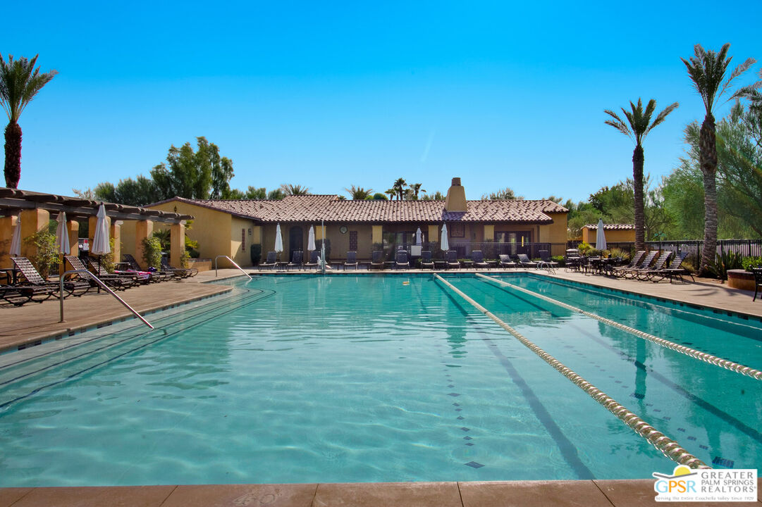 a view of a yard with a swimming pool