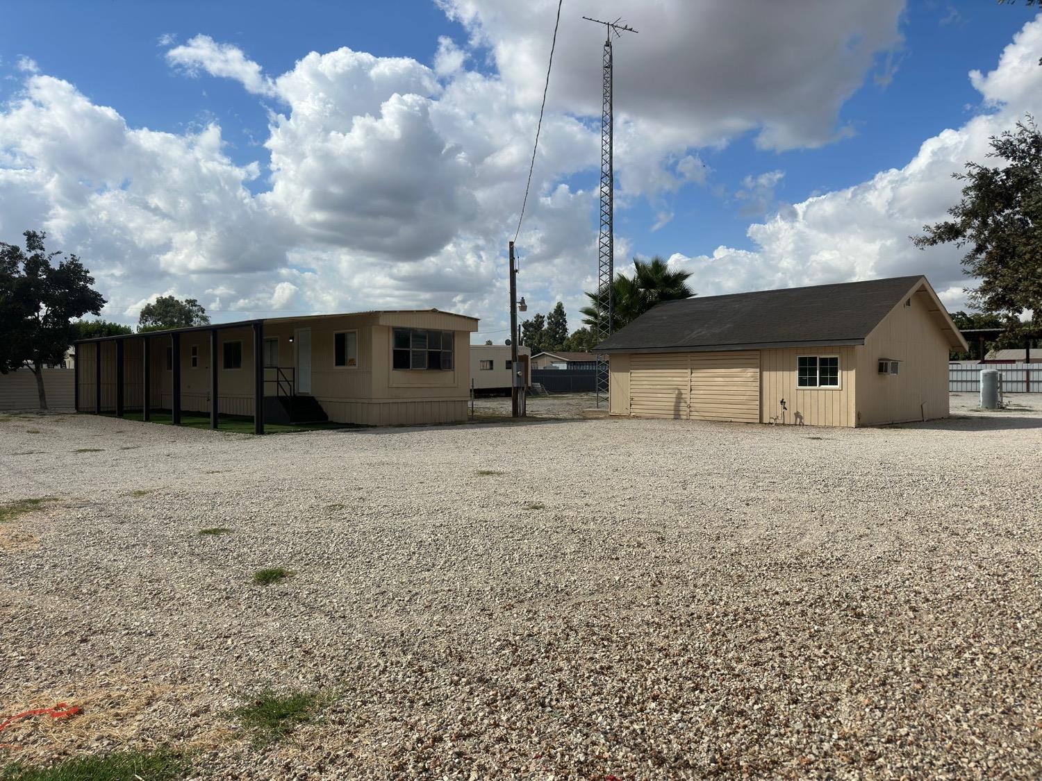 a view of house with a yard