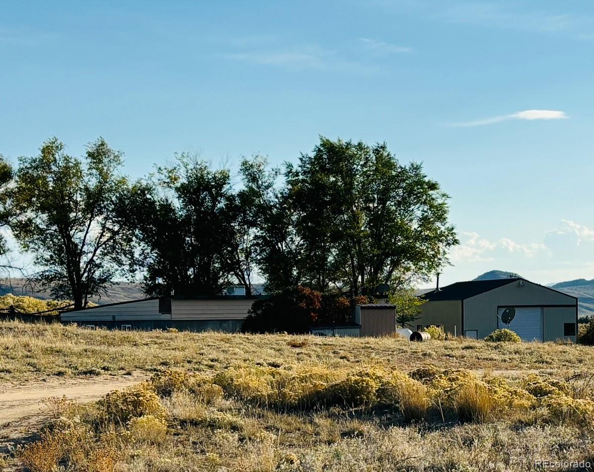 a view of a backyard of the house