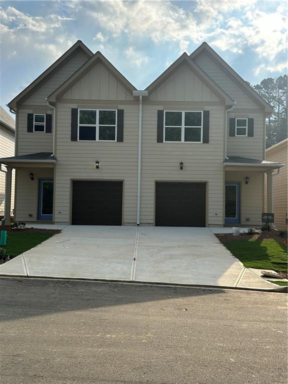 a front view of a house with yard