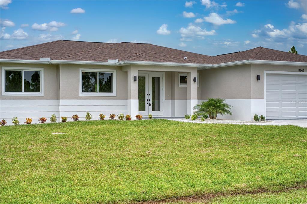 a front view of a house with a yard