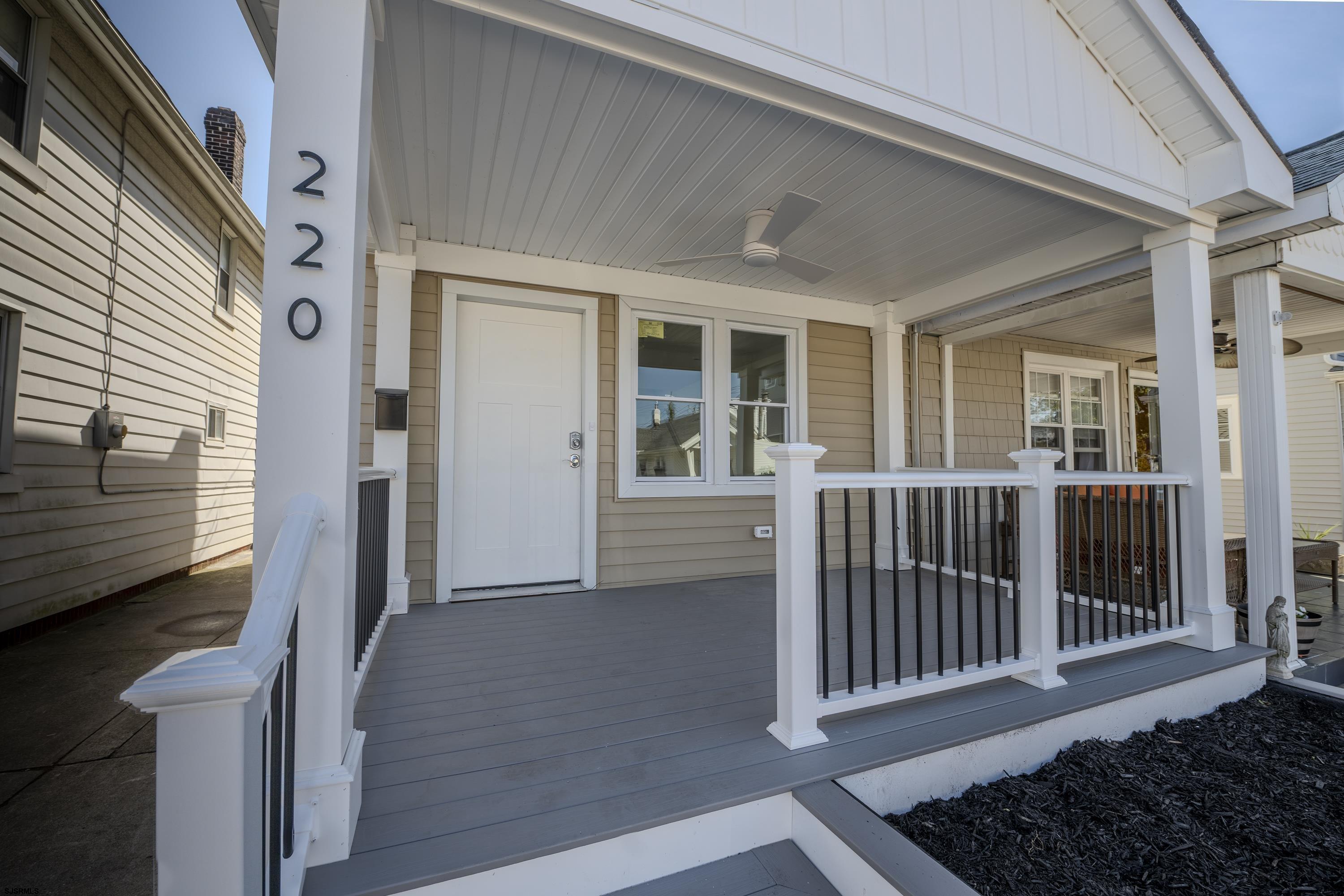 a view of a house with porch and wooden floor