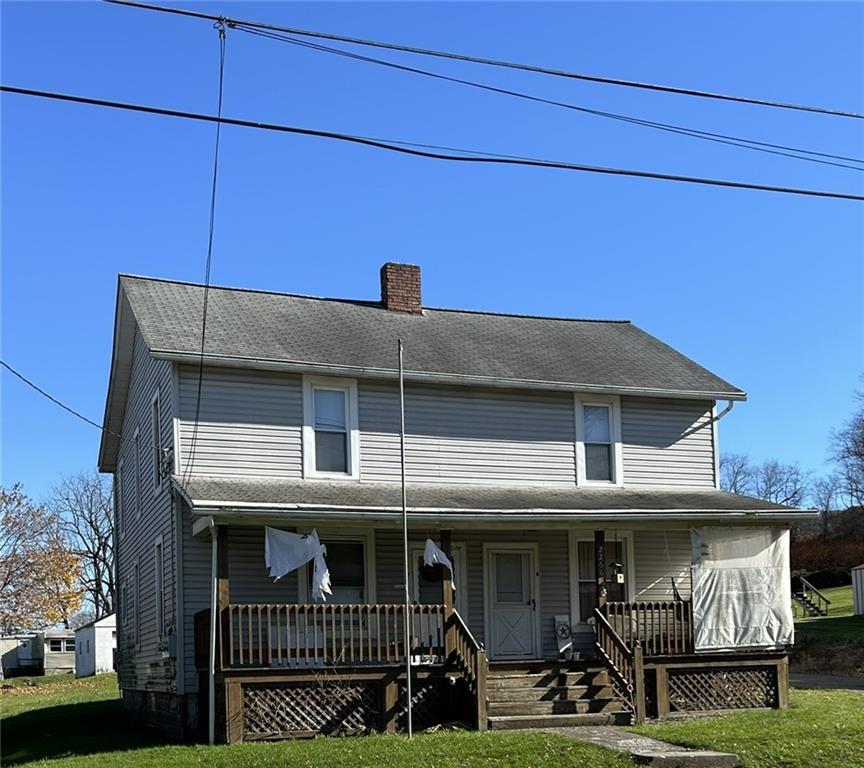 a view of a house with iron fence