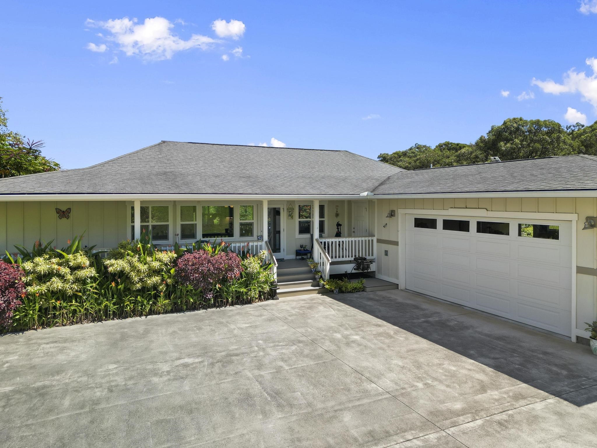 a front view of house with yard and outdoor seating